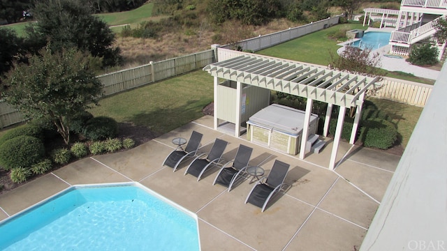 view of swimming pool with a fenced in pool, a fenced backyard, and a pergola