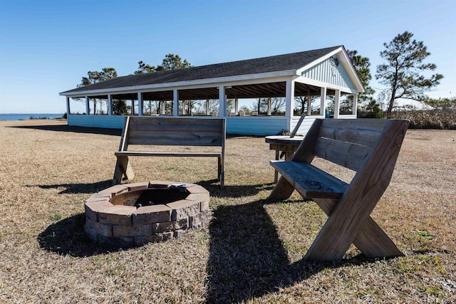 view of property's community featuring an outdoor fire pit