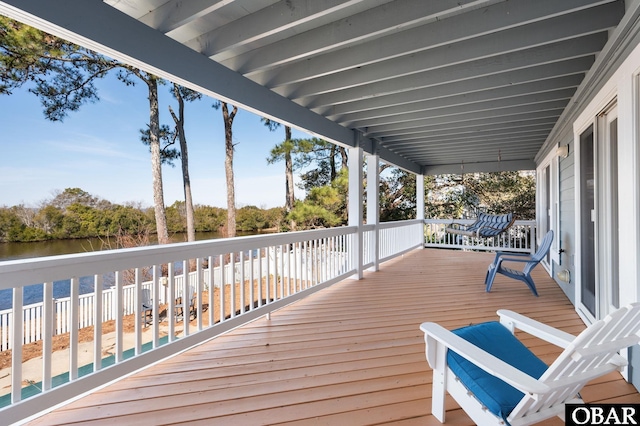 wooden terrace with a water view