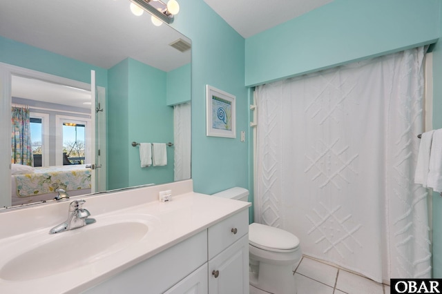 full bathroom featuring visible vents, vanity, toilet, and tile patterned floors