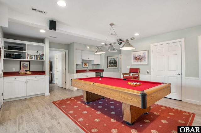 game room with visible vents, wainscoting, pool table, light wood-style floors, and recessed lighting