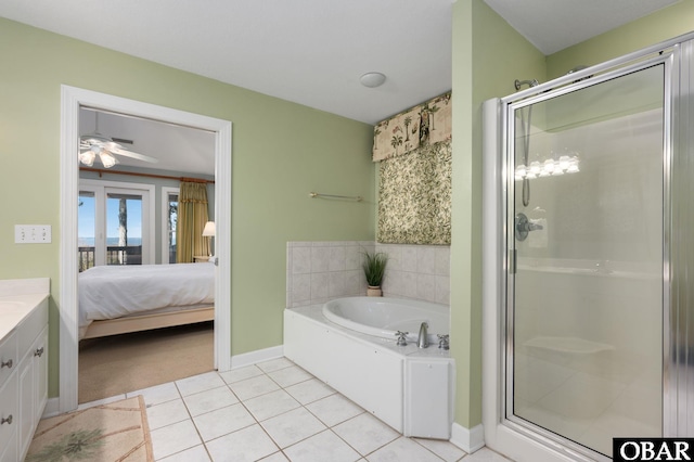 full bathroom featuring a garden tub, a shower stall, ensuite bath, vanity, and tile patterned flooring