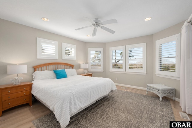 bedroom featuring recessed lighting, baseboards, visible vents, and light wood finished floors