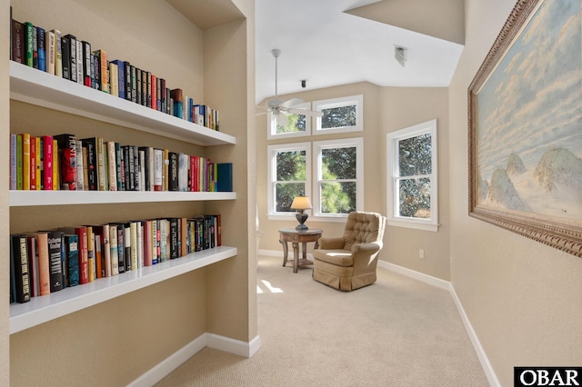 sitting room featuring lofted ceiling, ceiling fan, carpet flooring, visible vents, and baseboards