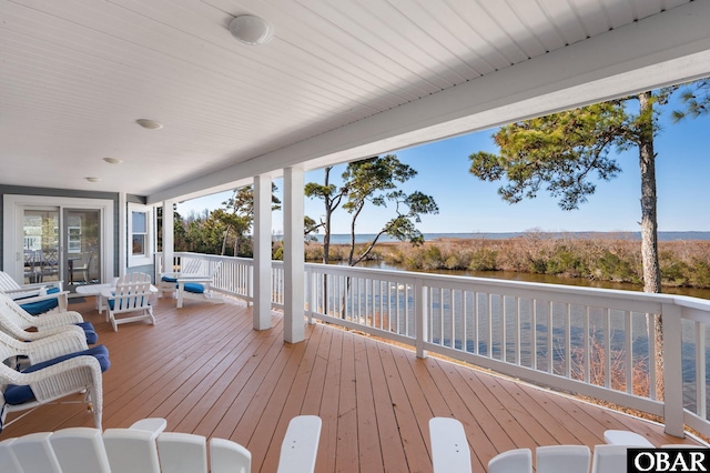 wooden deck featuring a water view