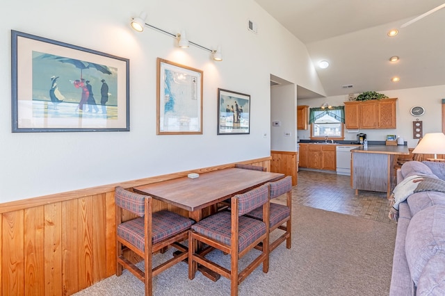 25253 Bold Dune Dr Lot 11, Waves, NC 27968 - dining room with wainscoting, lofted ceiling, wood walls, light carpet, and recessed lighting