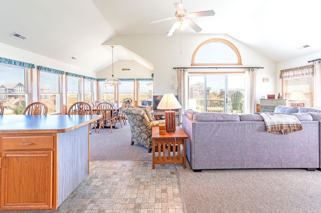25253 Bold Dune Dr Lot 11, Waves, NC 27968 - living area featuring light colored carpet, lofted ceiling, and a ceiling fan