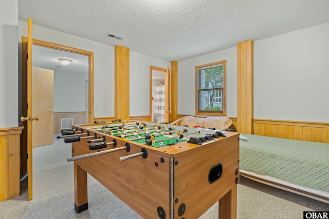 1039 Miller Ct Lot 526, Corolla, NC 27927 - rec room featuring a wainscoted wall, a textured ceiling, carpet, and wood walls