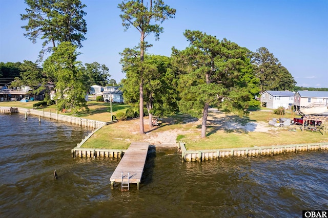 dock area featuring a water view and a yard