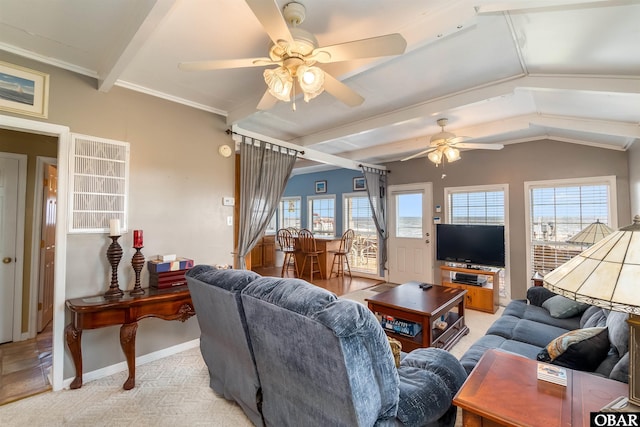 living area with vaulted ceiling with beams, light carpet, a wealth of natural light, and baseboards