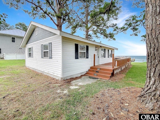 156 Longbeach Dr Unit Lot3, Hertford, NC 27944 - view of front of home featuring a deck with water view and a front yard