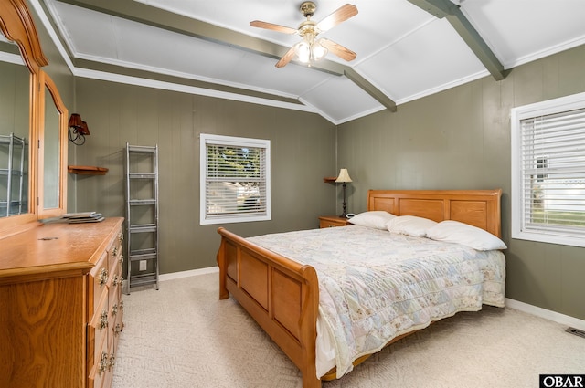 bedroom with ornamental molding, light colored carpet, lofted ceiling with beams, and baseboards