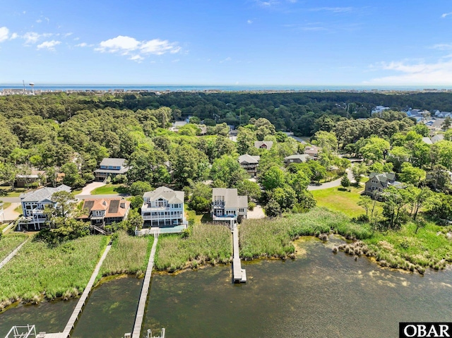 view of subject property with a nearby body of water