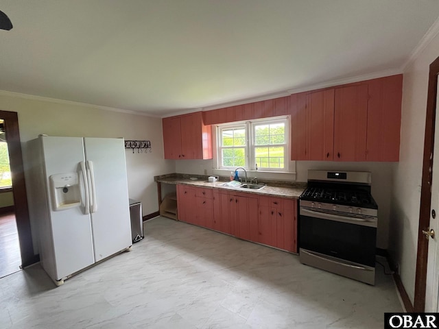 2253 Turnpike Rd, Swan Quarter, NC 27885 - kitchen with gas stove, white refrigerator with ice dispenser, and ornamental molding