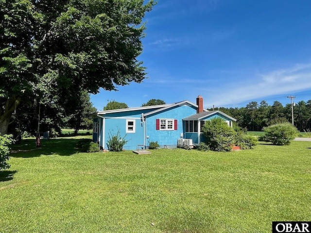 2253 Turnpike Rd, Swan Quarter, NC 27885 - view of side of property featuring a lawn and a cooling unit