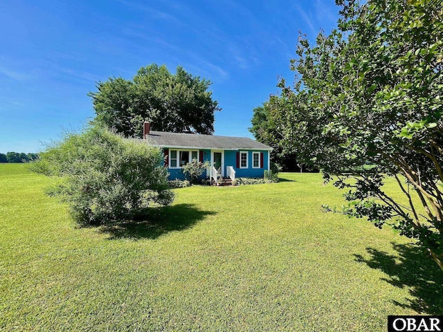 2253 Turnpike Rd, Swan Quarter, NC 27885 - ranch-style house featuring a front yard and a chimney