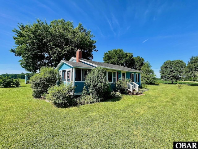 2253 Turnpike Rd, Swan Quarter, NC 27885 - view of front facade featuring a front yard and a chimney
