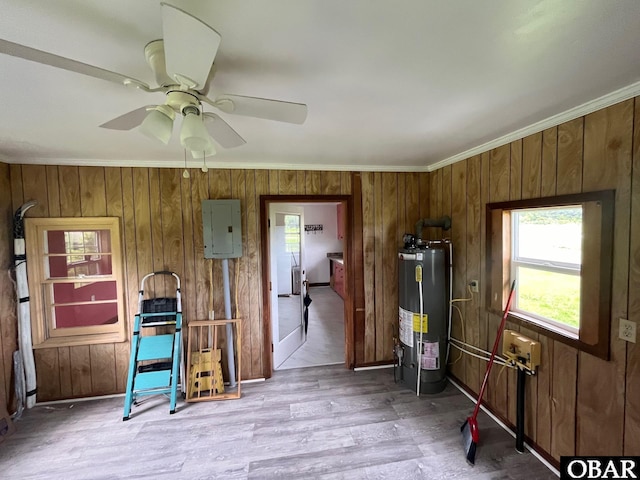 2253 Turnpike Rd, Swan Quarter, NC 27885 - kitchen with gas water heater, electric panel, wood walls, crown molding, and wood finished floors