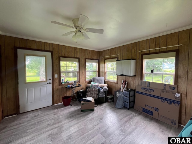 2253 Turnpike Rd, Swan Quarter, NC 27885 - sitting room with crown molding, a ceiling fan, wooden walls, and light wood-type flooring