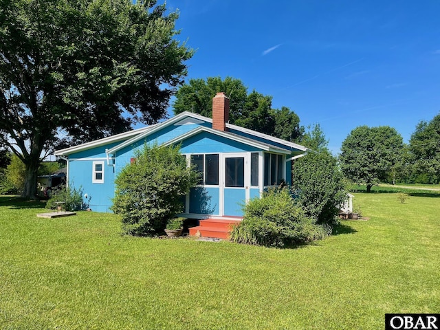 2253 Turnpike Rd, Swan Quarter, NC 27885 - rear view of house with a yard and a chimney