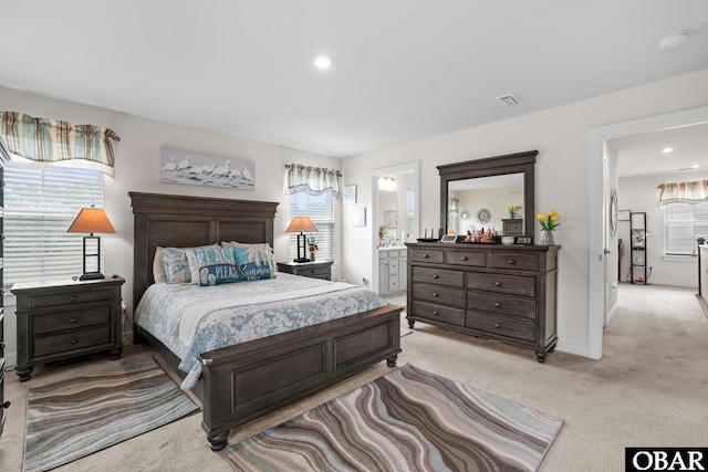 129 Glenmoor Path Lot 35, Moyock, NC 27958 - bedroom with light carpet, ensuite bathroom, baseboards, and recessed lighting