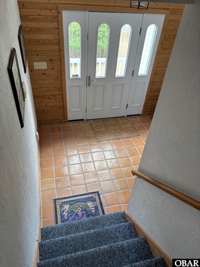 114 Poteskeet Dr Lot 66, Kitty Hawk, NC 27949 - tiled entryway with a textured wall, stairs, and wood walls