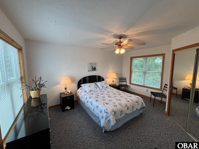 114 Poteskeet Dr Lot 66, Kitty Hawk, NC 27949 - carpeted bedroom with baseboards, ceiling fan, a textured ceiling, and a closet