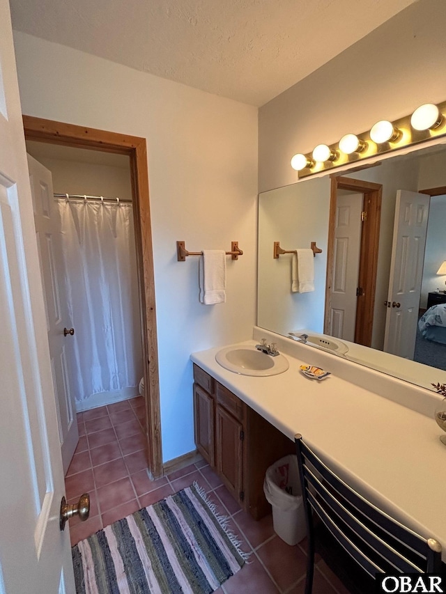 114 Poteskeet Dr Lot 66, Kitty Hawk, NC 27949 - full bath featuring tile patterned floors, vanity, toilet, a textured ceiling, and a shower with shower curtain
