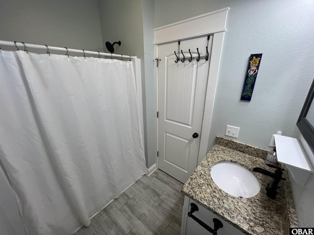 74 Lake Dr, Ocracoke, NC 27960 - bathroom featuring vanity and a shower with shower curtain