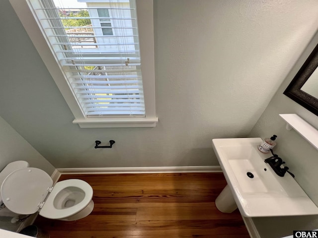 74 Lake Dr, Ocracoke, NC 27960 - half bath featuring wood finished floors and baseboards
