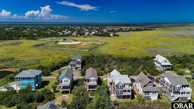 74 Lake Dr, Ocracoke, NC 27960 - aerial view of residential area featuring a large body of water