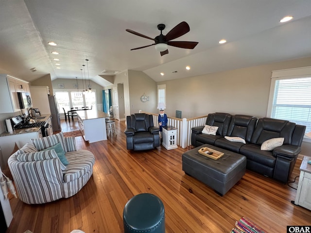 74 Lake Dr, Ocracoke, NC 27960 - living area featuring vaulted ceiling, a ceiling fan, wood-type flooring, and recessed lighting