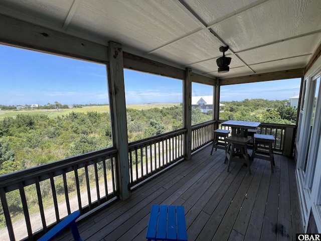 74 Lake Dr, Ocracoke, NC 27960 - wooden deck with a ceiling fan and outdoor dining area