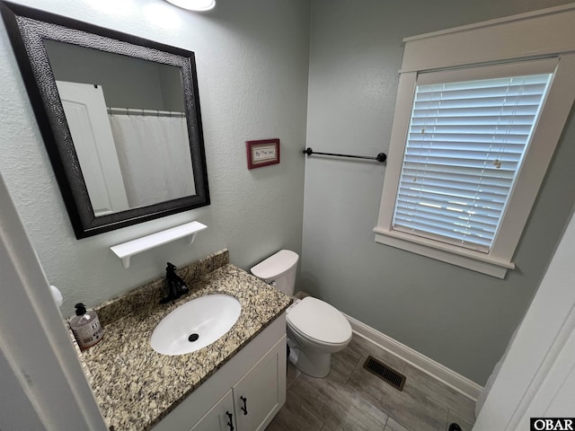 74 Lake Dr, Ocracoke, NC 27960 - full bath featuring vanity and wood finished floors