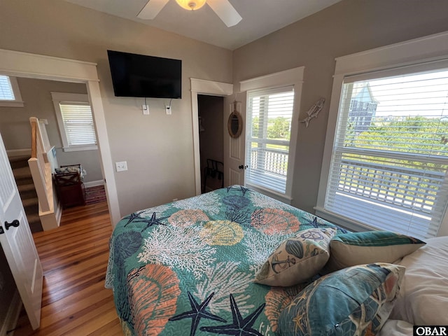 74 Lake Dr, Ocracoke, NC 27960 - bedroom featuring wood finished floors, a ceiling fan, and lofted ceiling