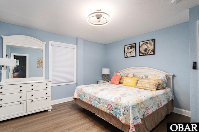 567 Ocean Trl Lot 140, Corolla, NC 27927 - bedroom with baseboards and wood finished floors