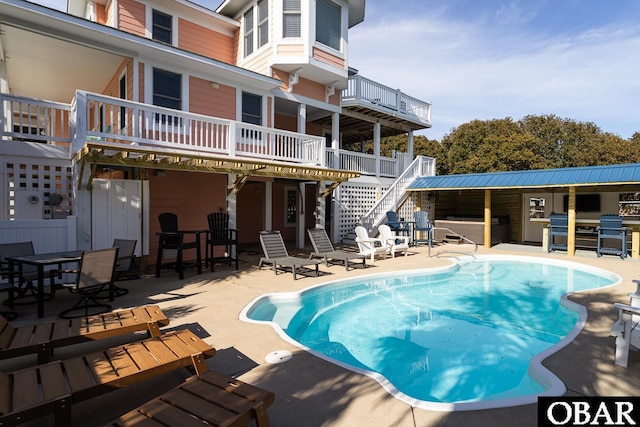 567 Ocean Trl Lot 140, Corolla, NC 27927 - swimming pool featuring stairway, a patio, and a wooden deck