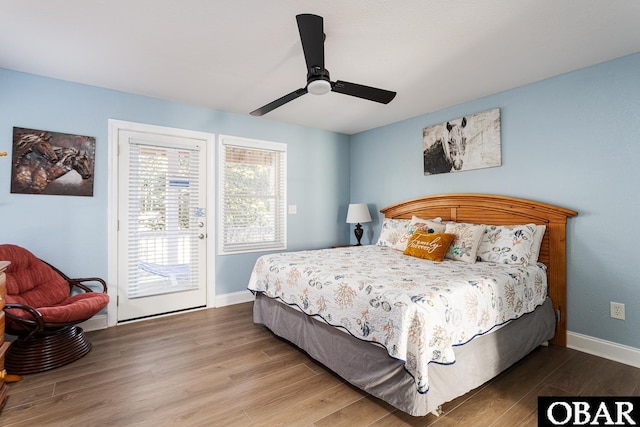 567 Ocean Trl Lot 140, Corolla, NC 27927 - bedroom featuring access to exterior, wood finished floors, baseboards, and ceiling fan