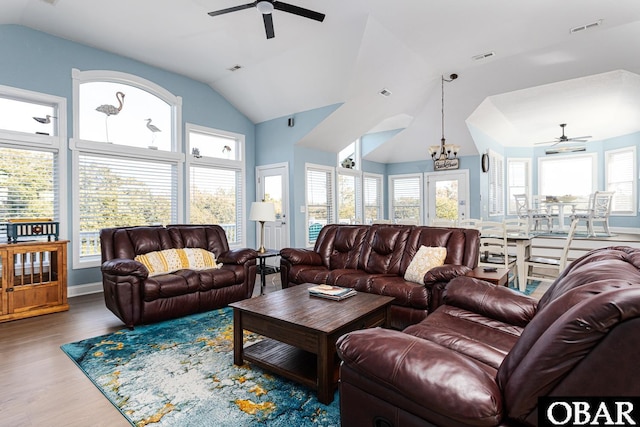 567 Ocean Trl Lot 140, Corolla, NC 27927 - living room with ceiling fan, vaulted ceiling, wood finished floors, and a chandelier