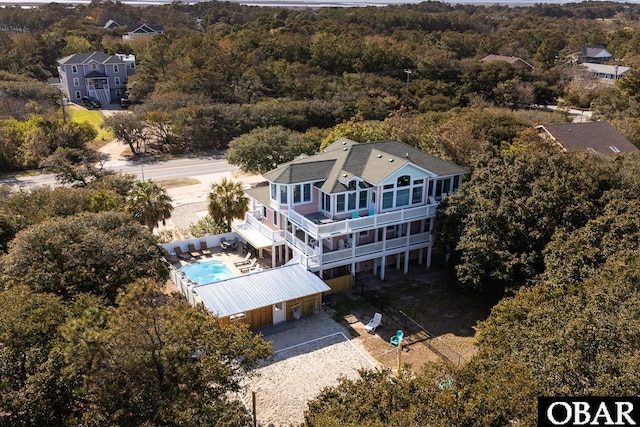 567 Ocean Trl Lot 140, Corolla, NC 27927 - aerial view of property and surrounding area with a forest and a pool area
