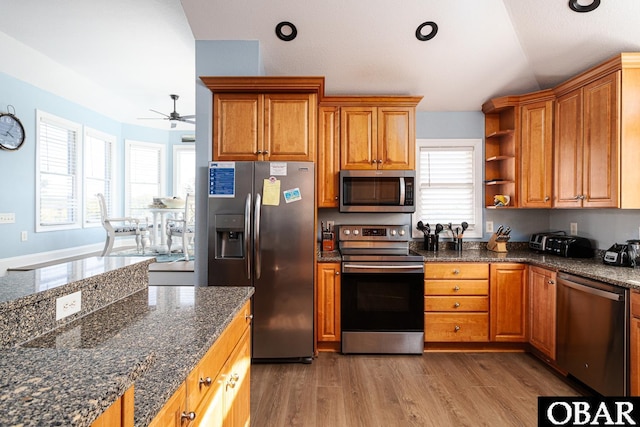 567 Ocean Trl Lot 140, Corolla, NC 27927 - kitchen featuring appliances with stainless steel finishes, a ceiling fan, healthy amount of natural light, brown cabinetry, and lofted ceiling