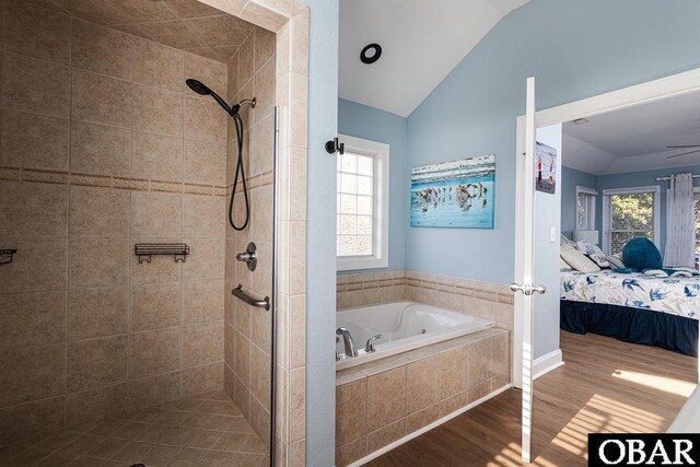 567 Ocean Trl Lot 140, Corolla, NC 27927 - full bathroom featuring vaulted ceiling, wood finished floors, ensuite bathroom, a shower stall, and a bath