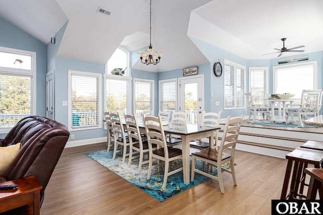 567 Ocean Trl Lot 140, Corolla, NC 27927 - dining area featuring lofted ceiling, wood finished floors, a ceiling fan, baseboards, and a chandelier
