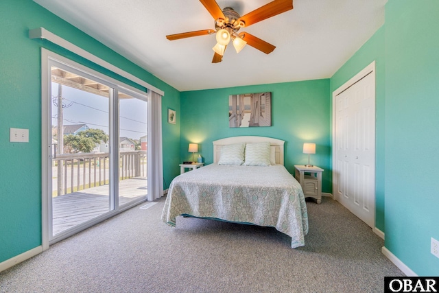 bedroom featuring carpet, access to outside, baseboards, and a closet