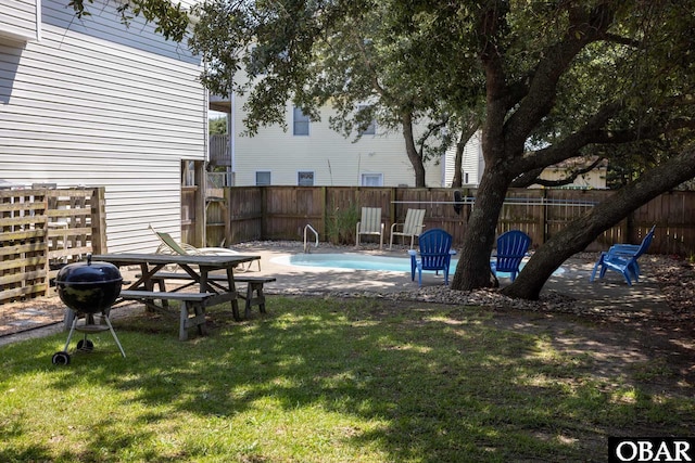 view of yard with a fenced in pool, a patio area, and a fenced backyard