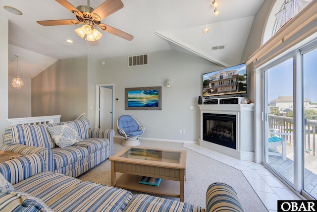 tiled living area featuring lofted ceiling, visible vents, a fireplace, and baseboards