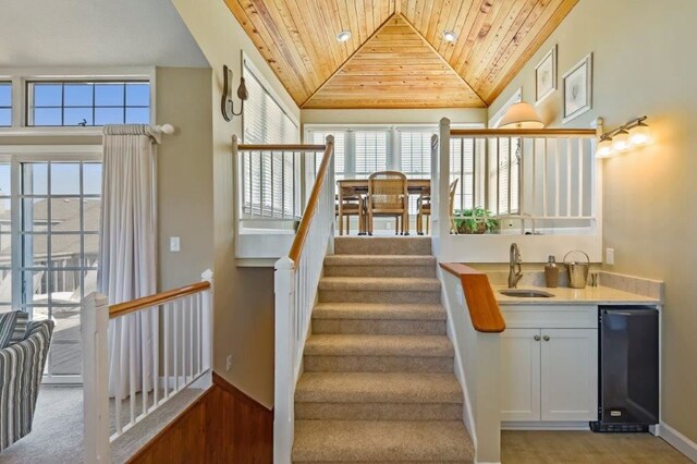137 Ships Watch Dr Lot 31, Duck, NC 27949 - stairway with wood ceiling, wet bar, and vaulted ceiling