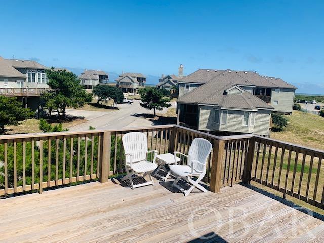 wooden deck with a residential view