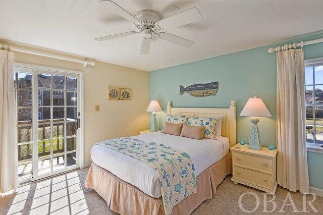 bedroom featuring access to exterior, light colored carpet, ceiling fan, and baseboards