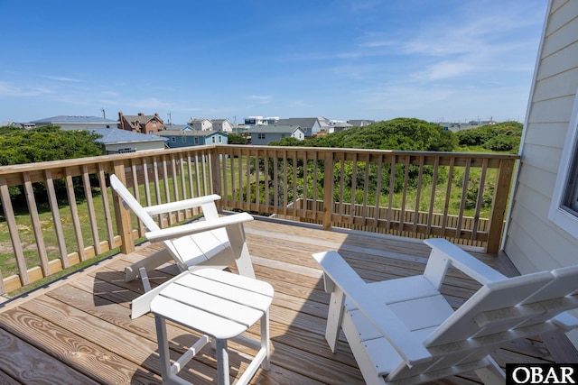 wooden deck with a residential view